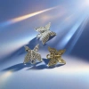 وهناك ثلاث فراشات مرصعة بحفر الفضة Specification image
